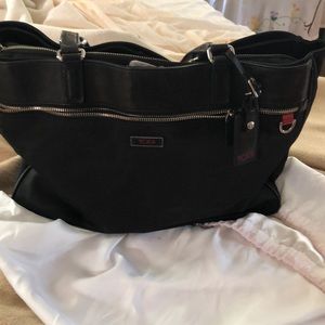 Black Tumi tote .  Has multiple pockets .